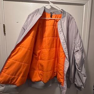 Oversized Grey/Silver H&M bomber with orange lining🩶🧡